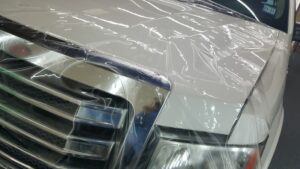 Putting paint protection on a white truck