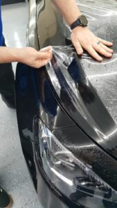 putting paint protection film on a car